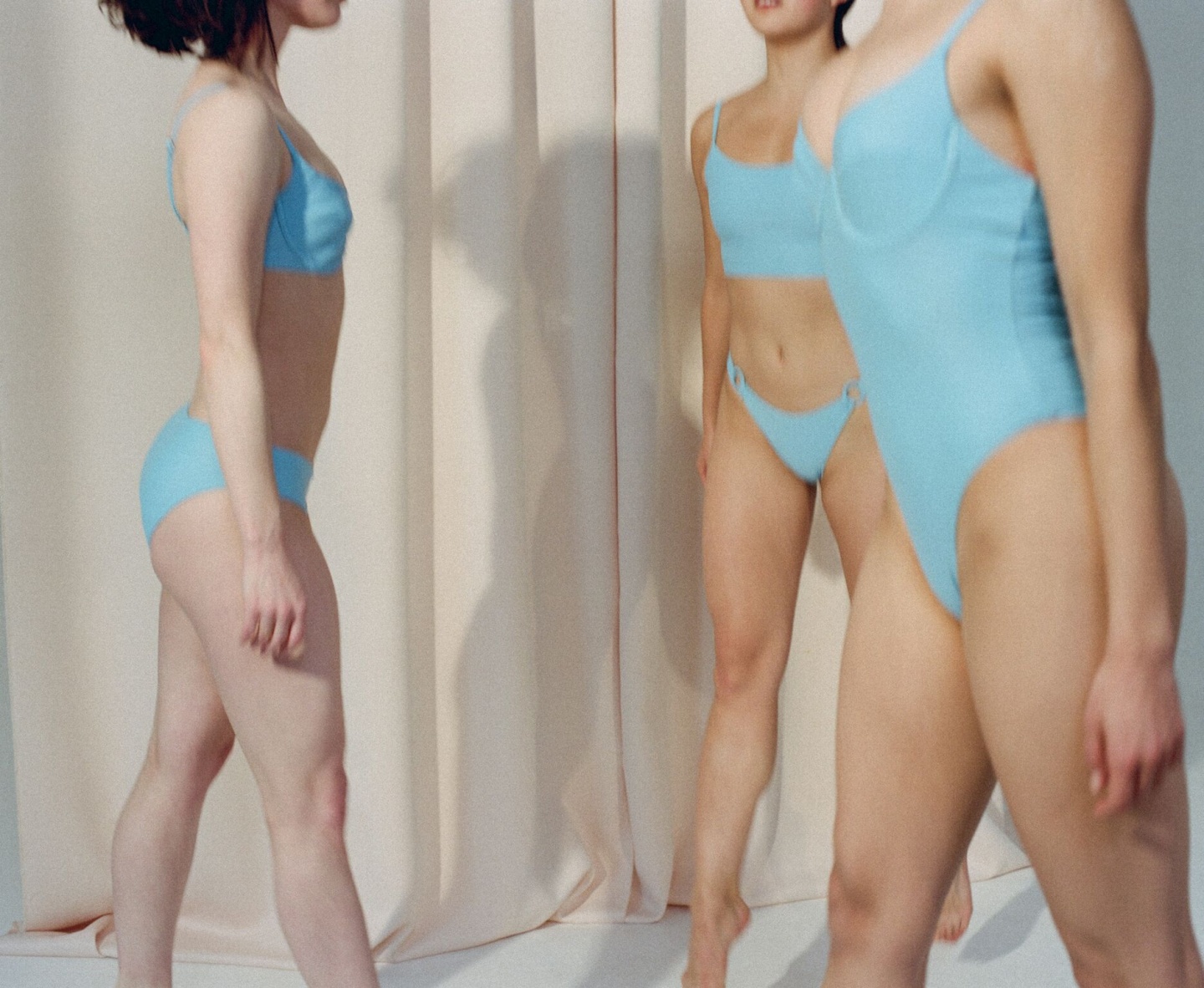 group of models in blue OOKIOH swimwear